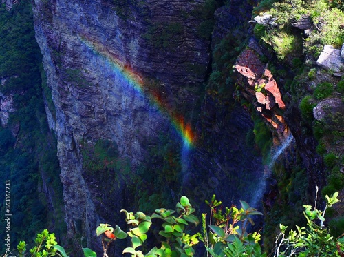 Rainbow over the dry waterfall photo