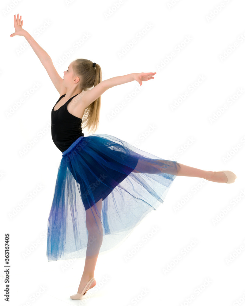 Teenage Girl Gymnast Standing on Tiptoe and Looking to the Side. Teenage Girl Gymnast Standing on Tiptoe and Looking to the Side.