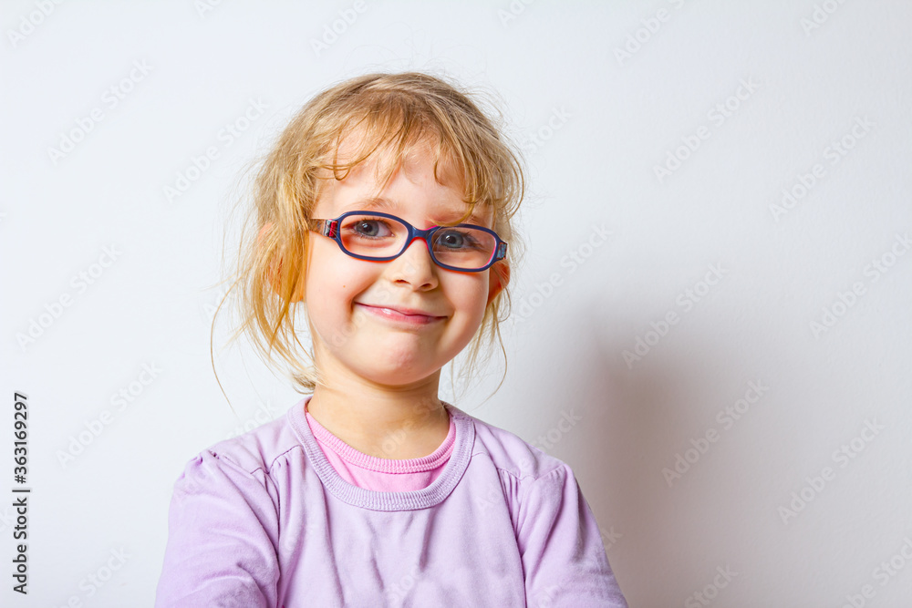 Portrait of sweet little girl with glasses