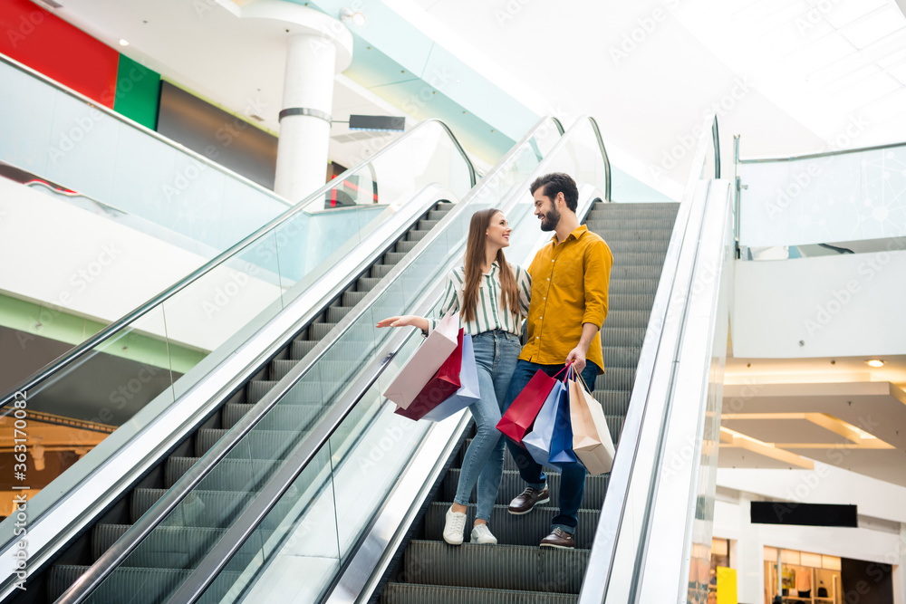 custom made wallpaper toronto digitalFull length photo of lovely lady handsome guy talking couple spend free time carry many bags moving down escalator shopping mall hug wear casual jeans shirt footwear outfit indoors
