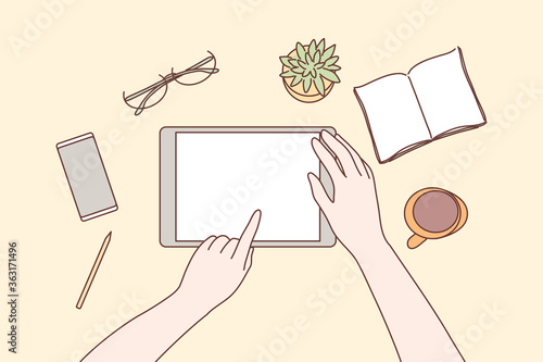 Technology, mobile, media, business concept. Human character hands using tablet in office for work or social network communication or watching videos. Digital technological devices in daily life.