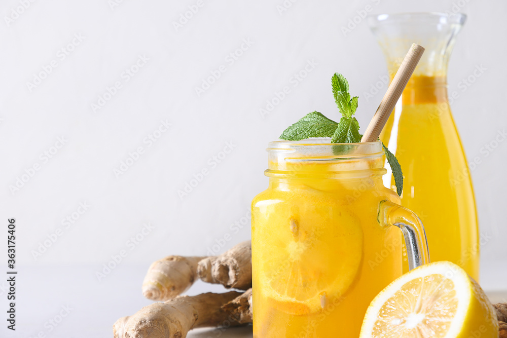 Indonesian herbal beverage Jamu with turmeric, ginger, lemon. Close up. Indonesian herbal beverage Jamu with turmeric, ginger, lemon. Close up.