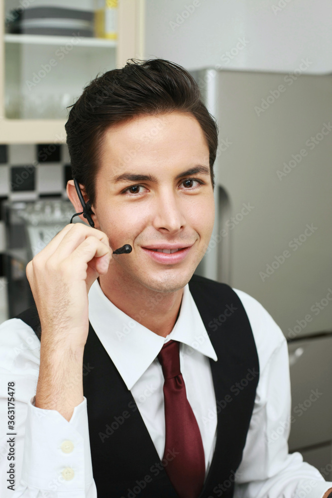 Businessman talking on telephone headset Businessman talking on telephone headset