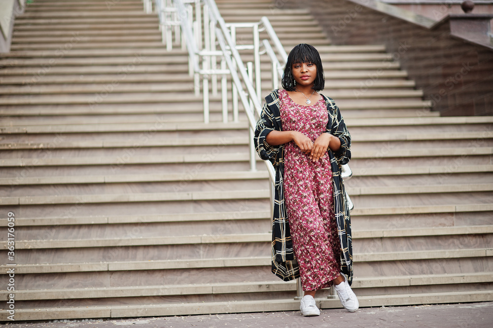 Portrait of beautiful african american woman standing on stairs. Portrait of beautiful african american woman standing on stairs.