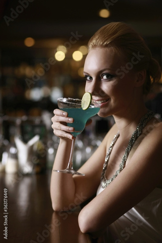 Woman with a glass of cocktail