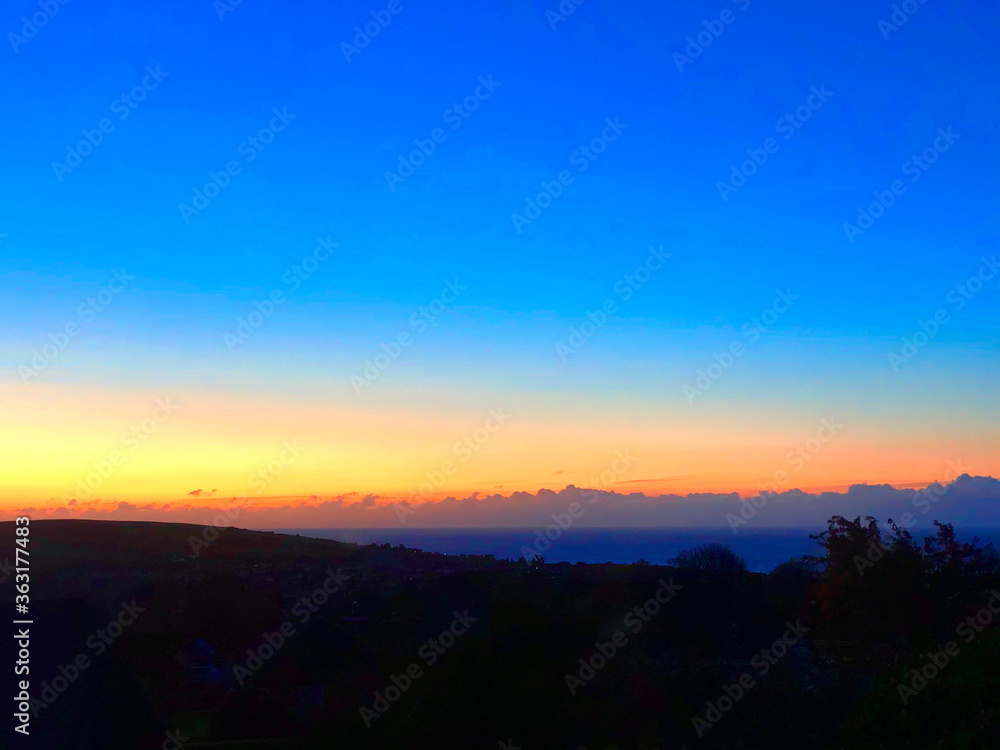 Beautiful sunrise over Onchan Isle of Man looking across the Irish Sea to the English Lake District