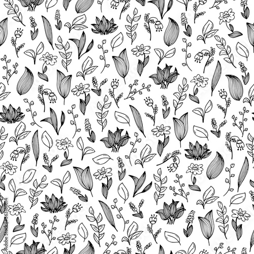 A seamless pattern with hand-drawn doodles of flowers and plants. Black and white