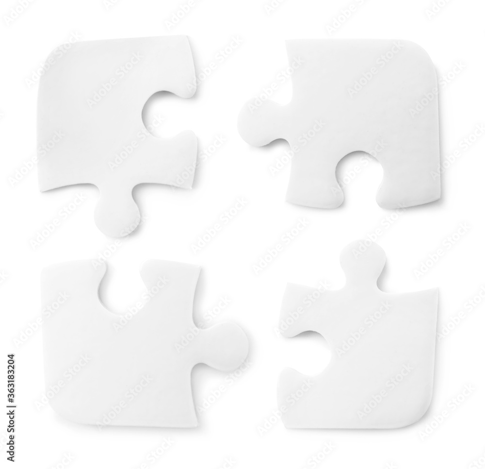 Set with jigsaw puzzle pieces on white background, top view Set with jigsaw puzzle pieces on white background, top view