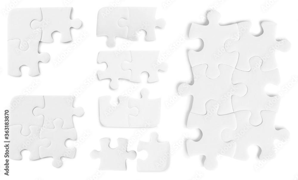 Set with jigsaw puzzle pieces on white background, top view Set with jigsaw puzzle pieces on white background, top view