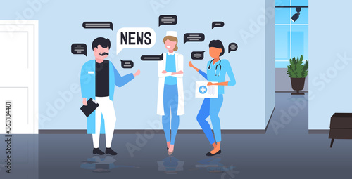 doctors team chatting during meeting discussing daily news chat bubble communication concept hospital interior full length vector illustration