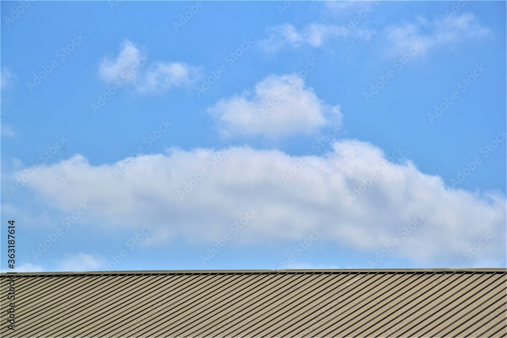 Horizontal roof texture surface with blue sky on the background Horizontal roof texture surface with blue sky on the background
