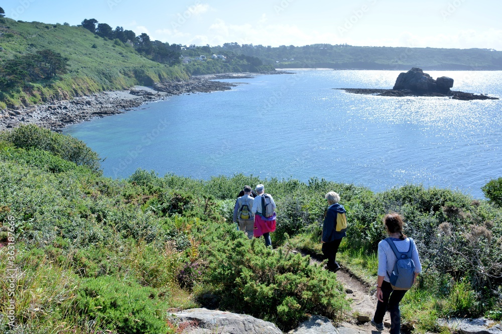 Senior hikers on the path along the sea in Brittany France