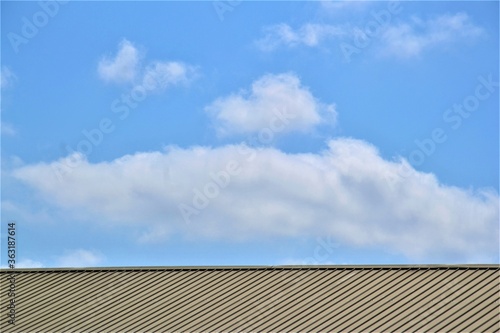 Horizontal roof texture surface with blue sky on the background