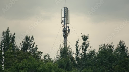 Cinematic shot: Telecommunication tower. Telecom tower antennas and satellite transmits the signals of cellular 5g 4g mobile signals to the consumers and smartphones. 4k. 25 fps