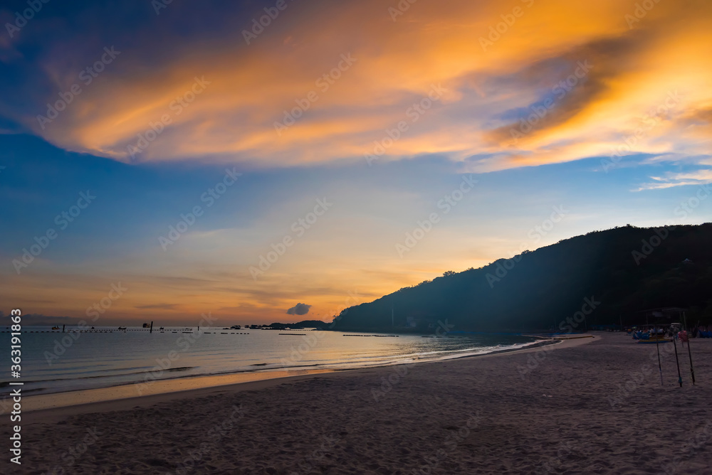 Chon Buri, Thailand - June, 28, 2020 :  Pictures of Tawaen Beach in the dawn, the sun was rising, morning sunrise  time on Koh Lan island after the outbreak of the Covid 19 virus.