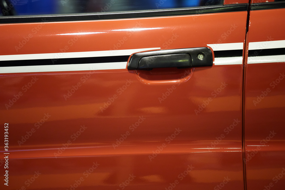 Door handle of a red sports car
