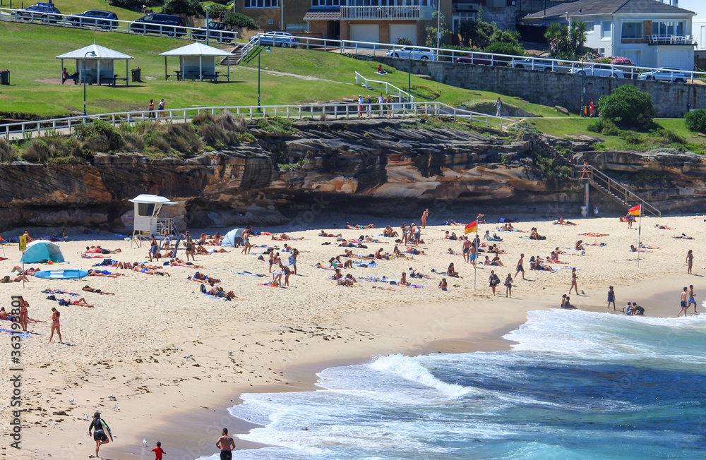 The beach with cliff and park in background. Bronte beach, Sydney Australia