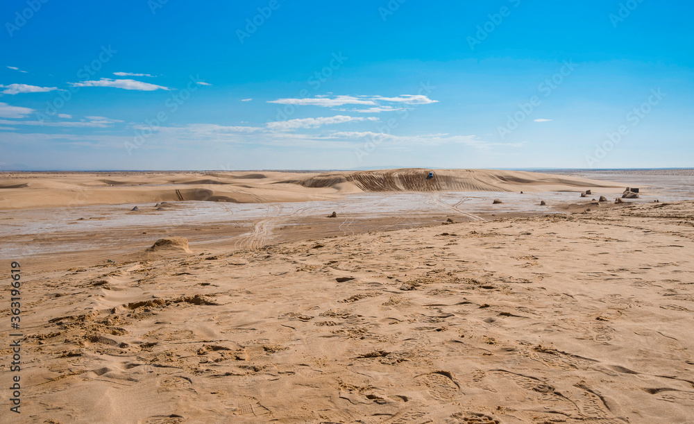 salt marsh in the Sahara desert between sand dunes
