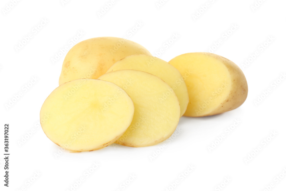 Whole and cut fresh raw organic potatoes on white background