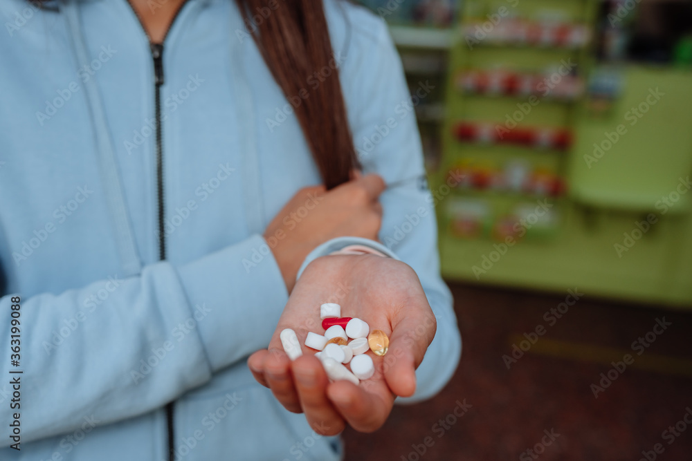 Coronavirus. Covid-19. A man or woman takes and shows pills. Coronavirus. Covid-19. A man or woman takes and shows pills.