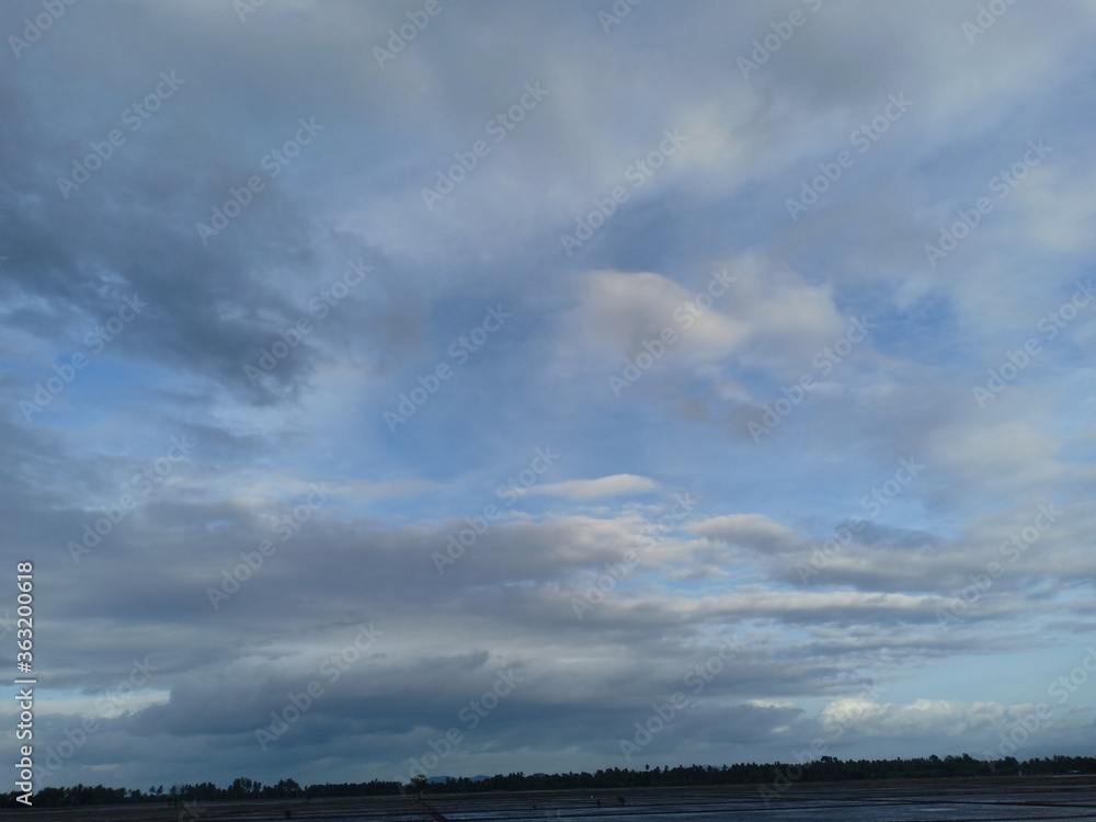 white clouds against a blue sky background white clouds against a blue sky background