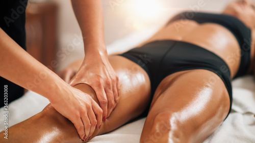 Anti Cellulite Thigh Massage in a Beauty Spa Salon. photo