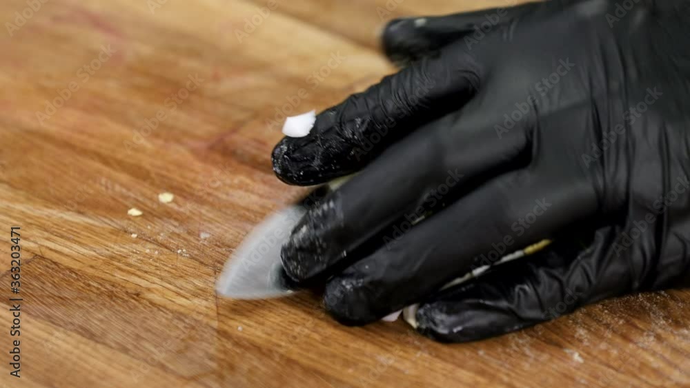 Close up of chef dicing a boiled egg on wooden cutting board in the modern kitchen. 4K Close up of chef dicing a boiled egg on wooden cutting board in the modern kitchen. 4K