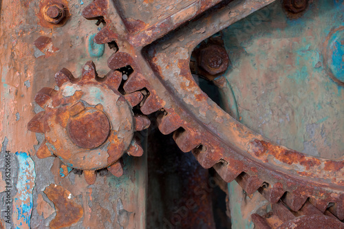 close-up view of old rusty gears, warm colors