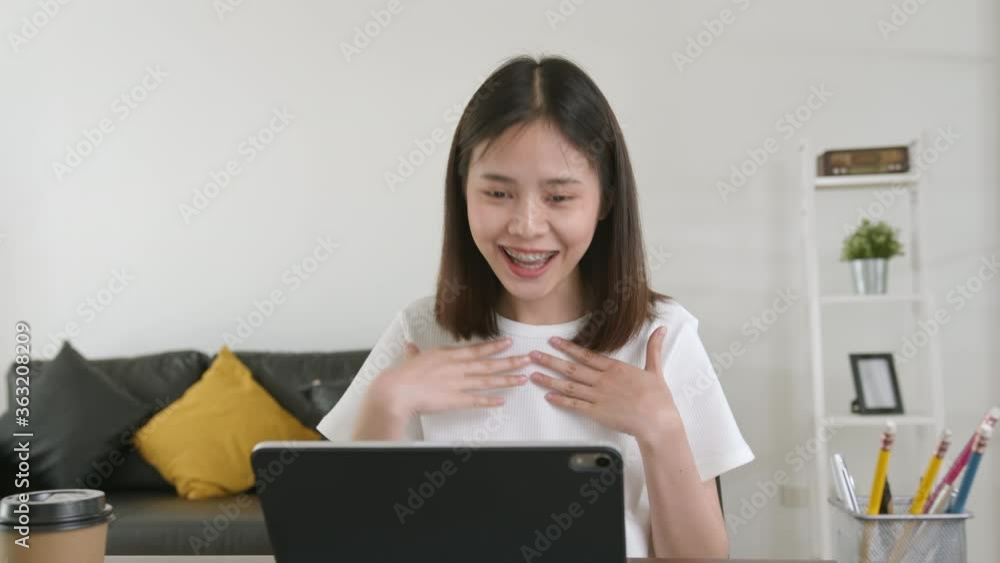 Young Asian woman using digital tablet and video call with learning online on internet. chatting with teacher. Young Asian woman using digital tablet and video call with learning online on internet. chatting with teacher.