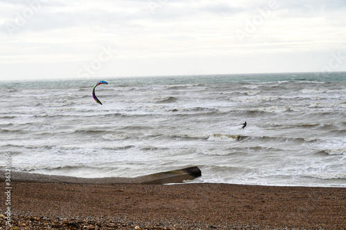 Kite Surfer riding waves near the beach