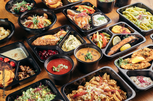 group of food in plastic dish on table. take away food © cherryandbees