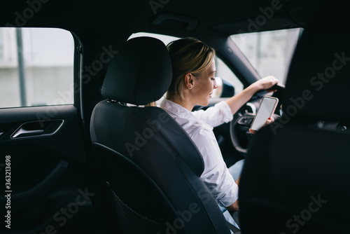 Woman driver in vehicle interior