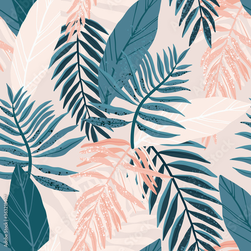 Seamless hand drawn tropical vector pattern with exotic palm leaves and various plants on light background.