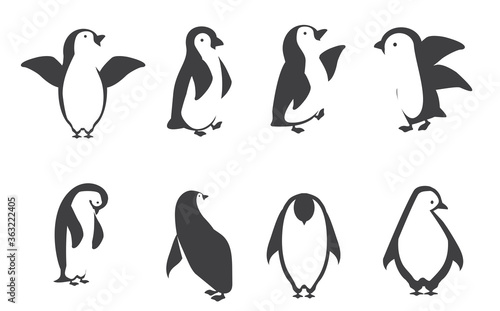 Happy penguin characters in different poses icon set