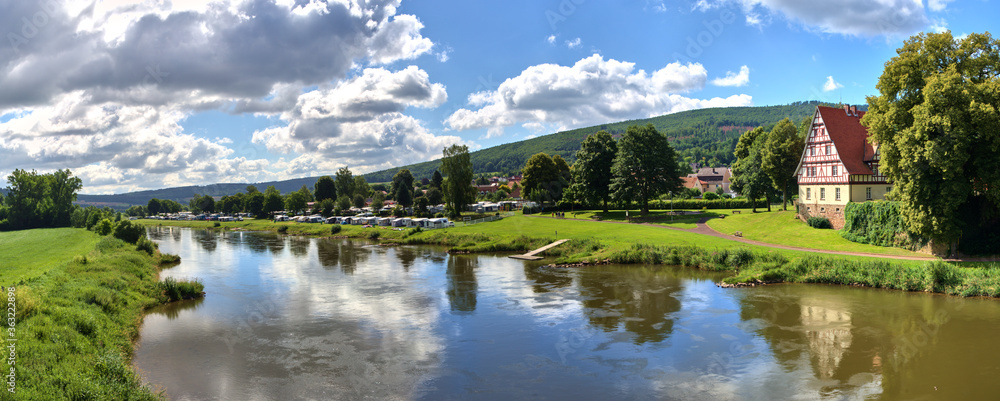 Upper course of the Weser with a half-timbered house, trees and a camping site, composite panorama in high resolution