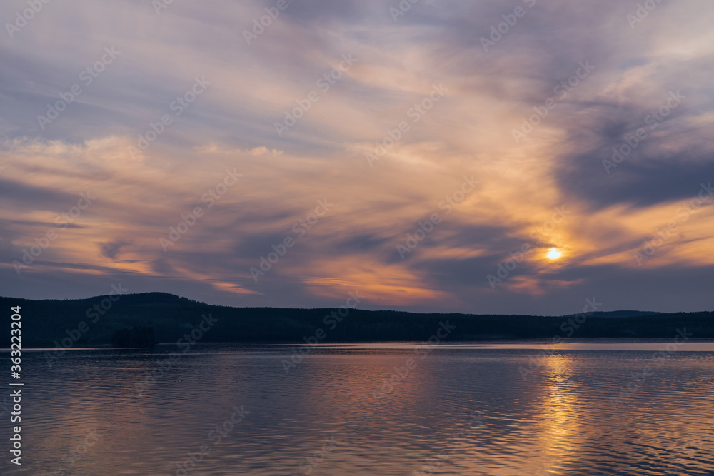 Fototapeta premium beautiful clouds during sunset over the lake
