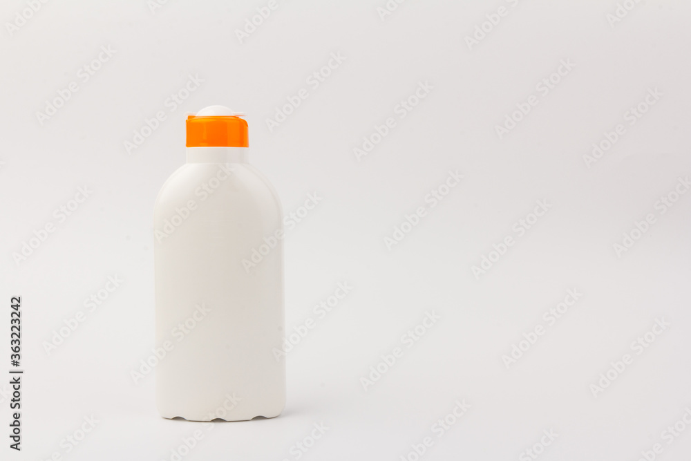 Sunscreen bottle on white background. Health concepts and skin care Sunscreen bottle on white background. Health concepts and skin care