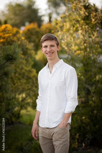 Young blonde man. Man outside. Outside on nature