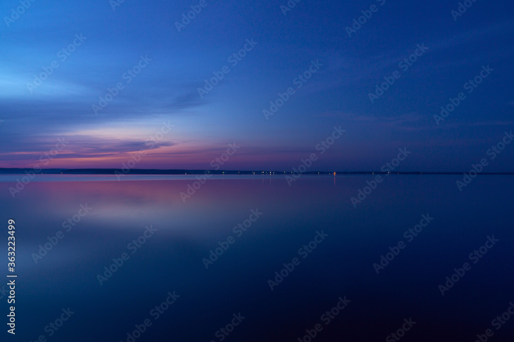 beautiful clouds during blue hour over the lake