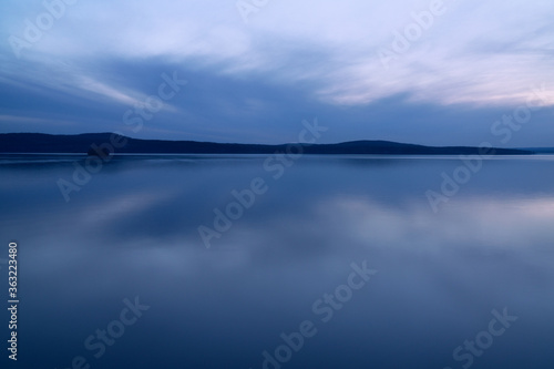 beautiful clouds during blue hour over the lake
