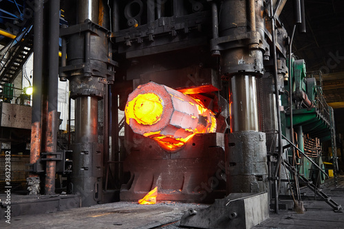 Bild auf Leinwand Forging a workpiece on a forging press. Forging production.