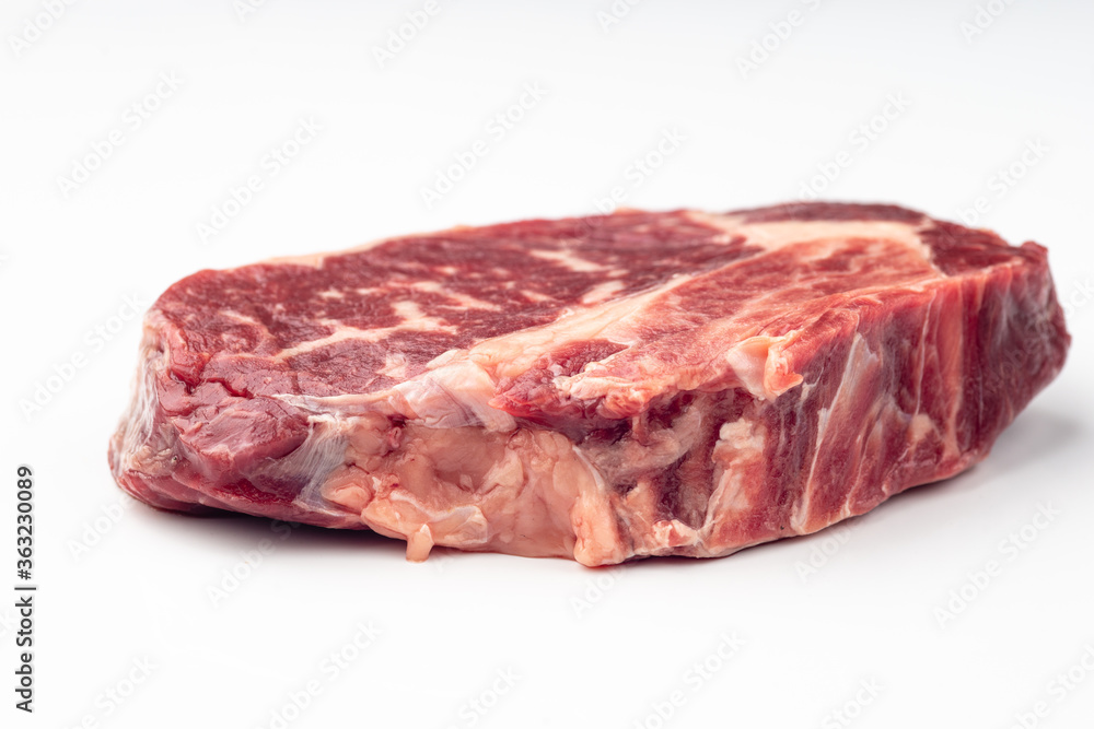 Fresh raw beef steak isolated on white background.