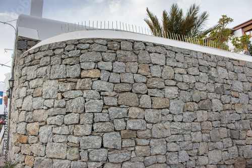 Fototapeta Naklejka Na Ścianę i Meble -  Mykonos, Greece | Mykonos Stone Wall