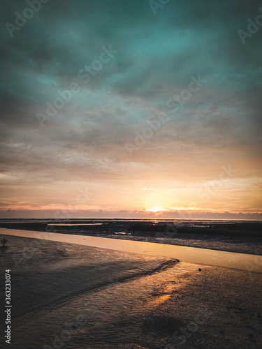sunset on the beach © yihchang