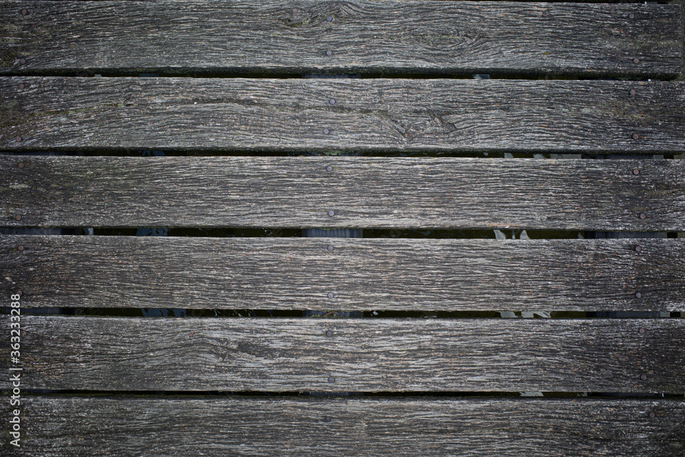 The boards of wooden bar form a homogeneous pattern The boards of wooden bar form a homogeneous pattern