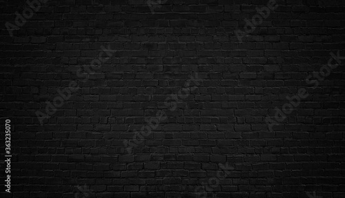 Black urban brick wall background or texture