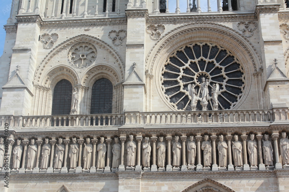 A close up of the exterior facade of the Notre Dame of Paris, France