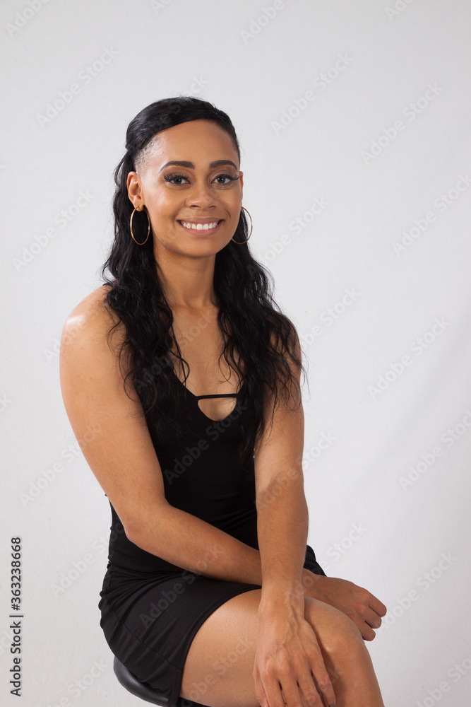 Happy woman sitting with a smile Happy woman sitting with a smile