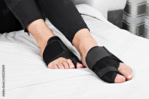 Woman foot bunion protection. Bunion corrector. lifestyles photos in bed, on floor. different angels.