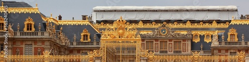 Panoramic view of the golden gates of the Palace of Versailles, France